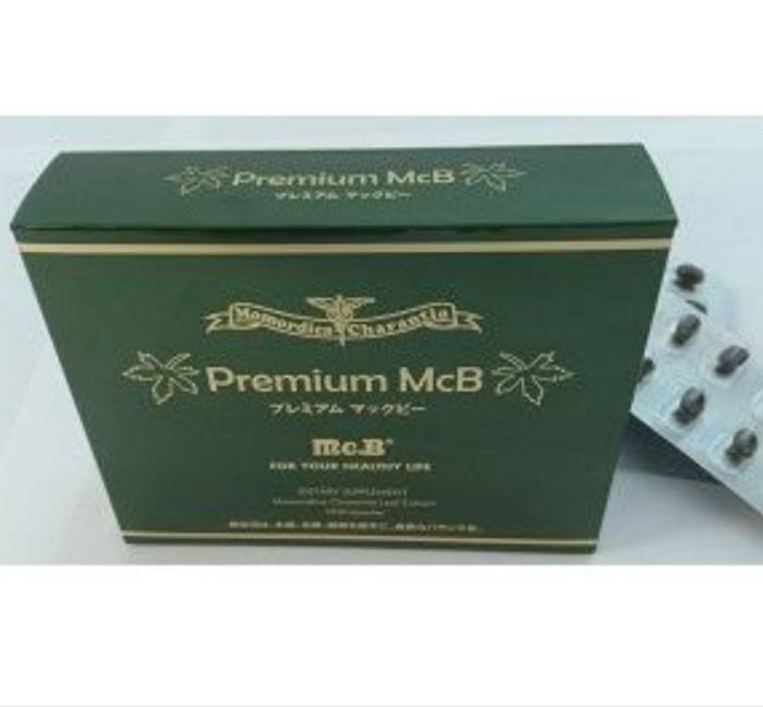 Premium McBの深緑色の箱とカプセルシートの商品写真